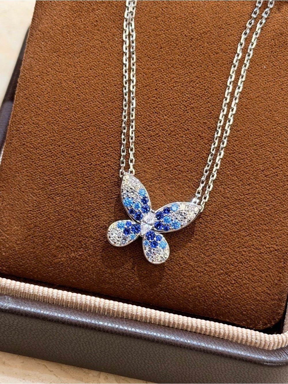 Silver Butterfly Pendant Necklace with Blue and White Stones